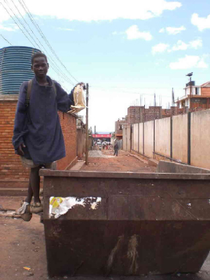 Robert searches the rubbish