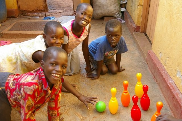 children playing with skittles
