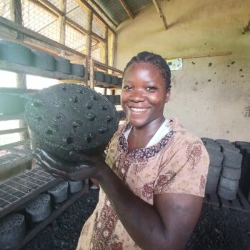 volunteer holding a briquette