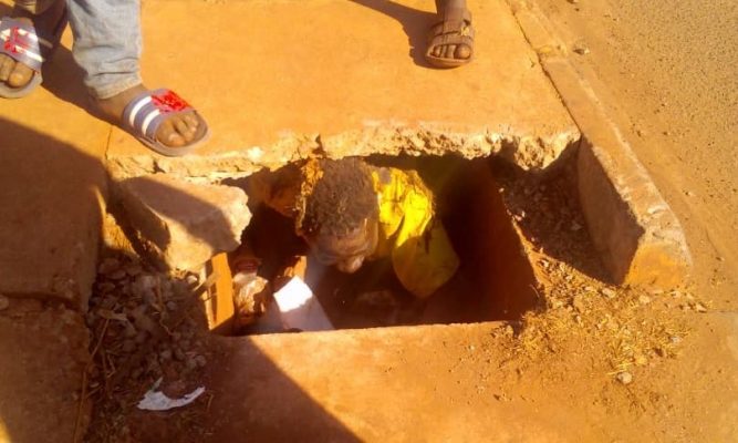 child inside a drain