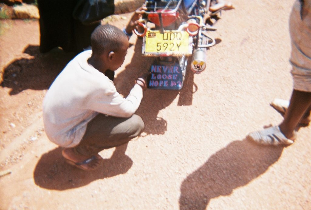 child crouching down on the street