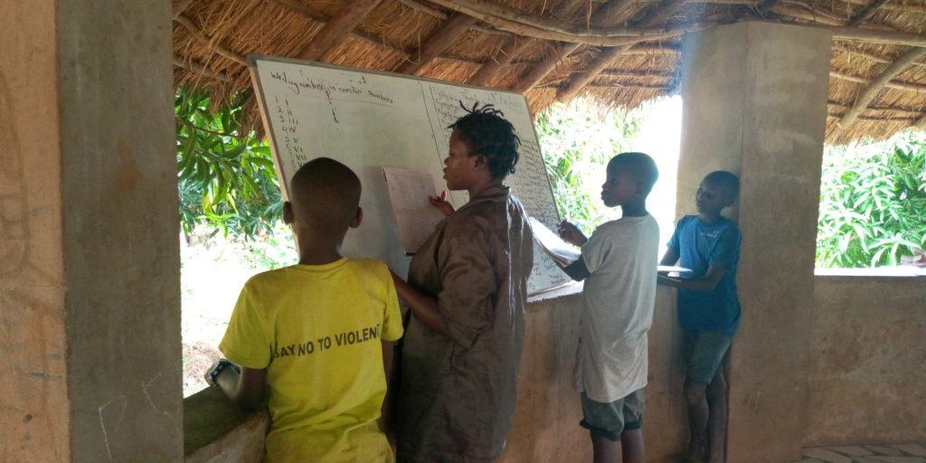 children learning at a whiteboard