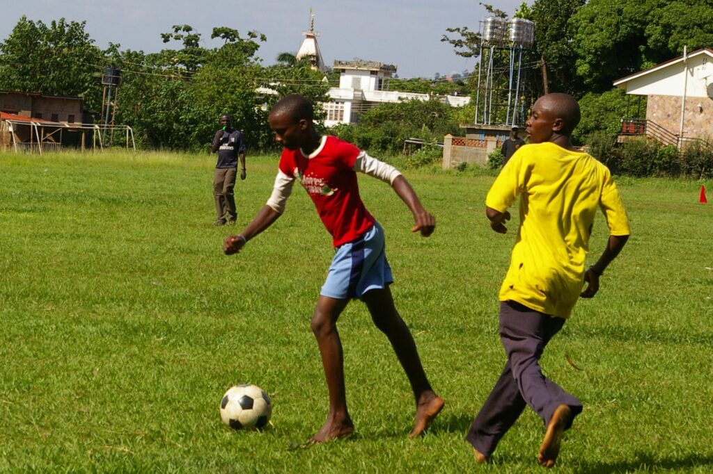 boys playing football