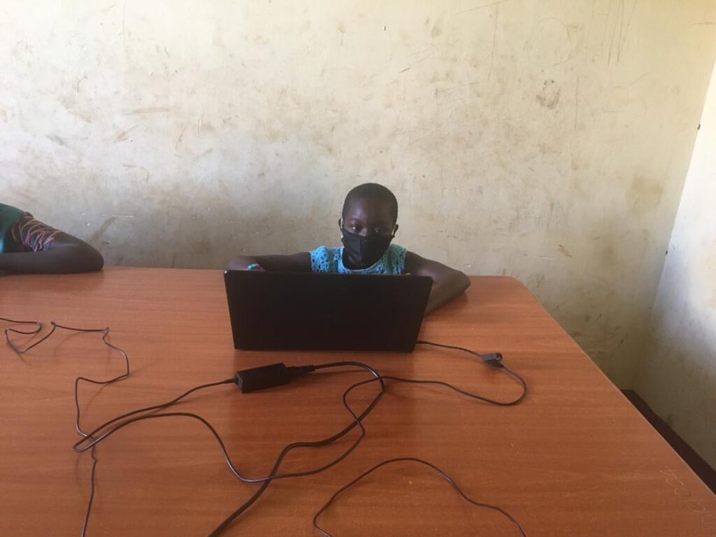 young boy in Uganda learning about climate change