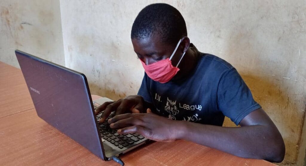 Boy typing on computer