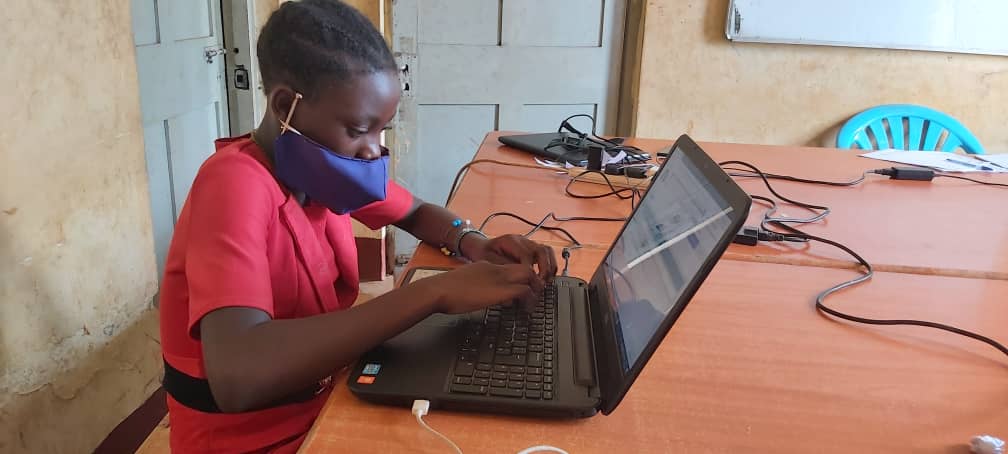 A child works on a laptop