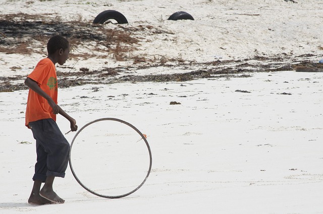 A child playing with a hoop