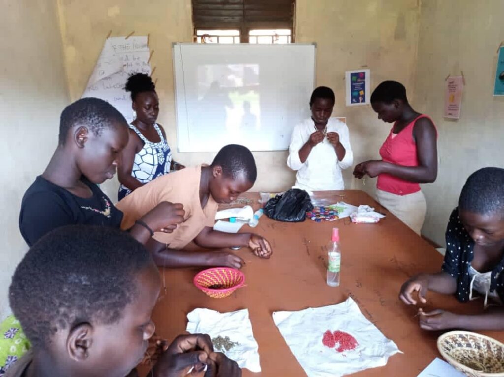 Girls making jewelry