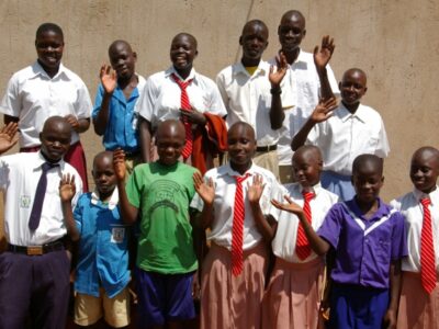 A group of school children waving