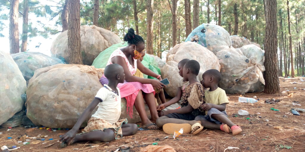 A woman with children sat around her