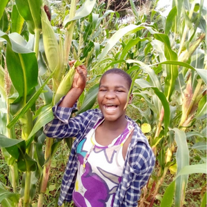 Girl smiling in a field of crops