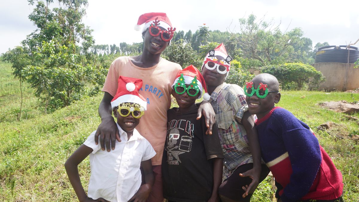 Children wearing christmas hats and decorations