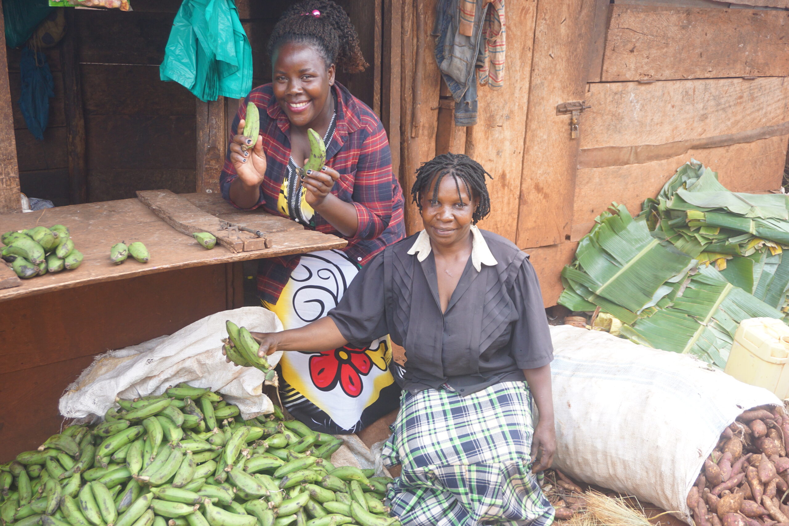 S.A.L.V.E. Family Business Empowerment worker and a lady who she gave training to on Business Empowerment at her market stall