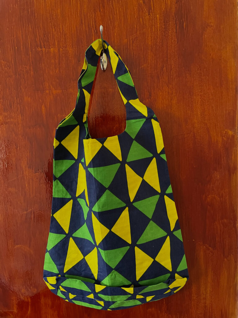 green, blue and yellow shopping bag with geometrical pattern