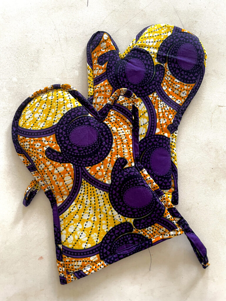 purple glove with yellow and orange designs