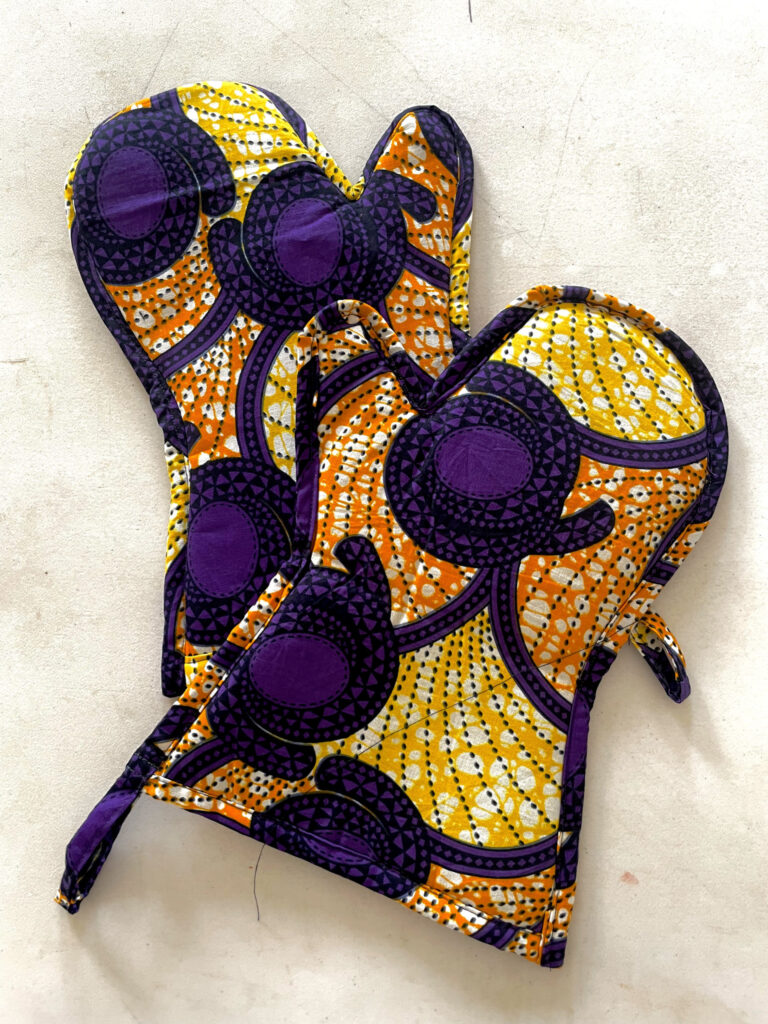 purple glove oven with orange and yellow designs