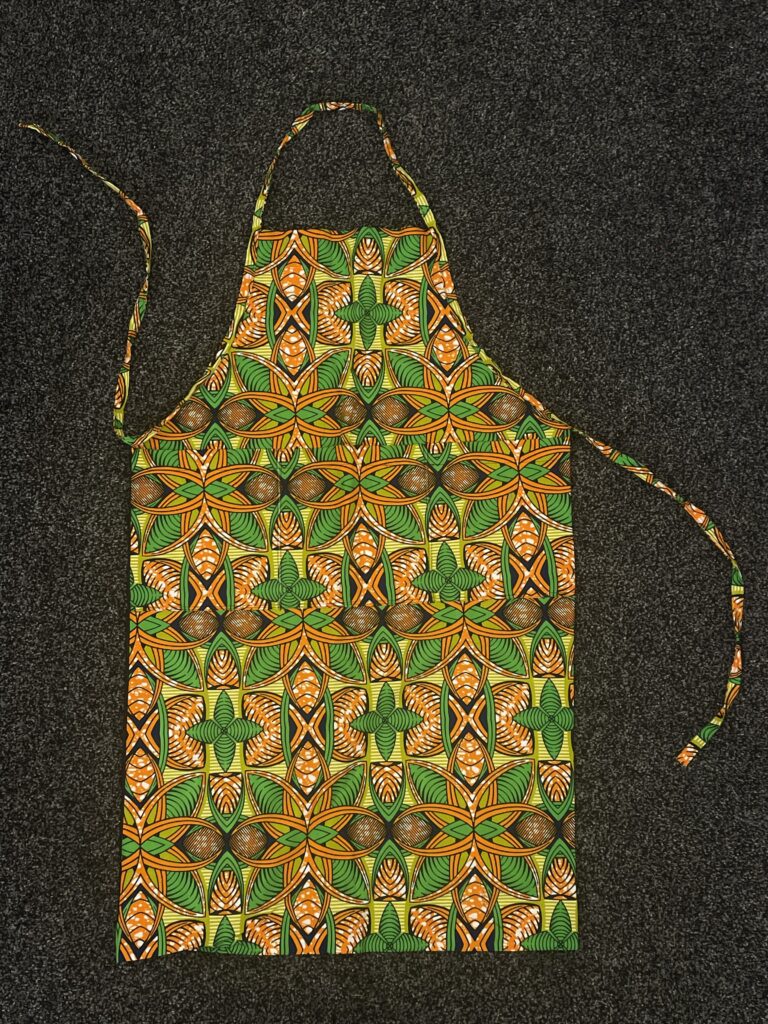 apron with orange, yellow and green pattern