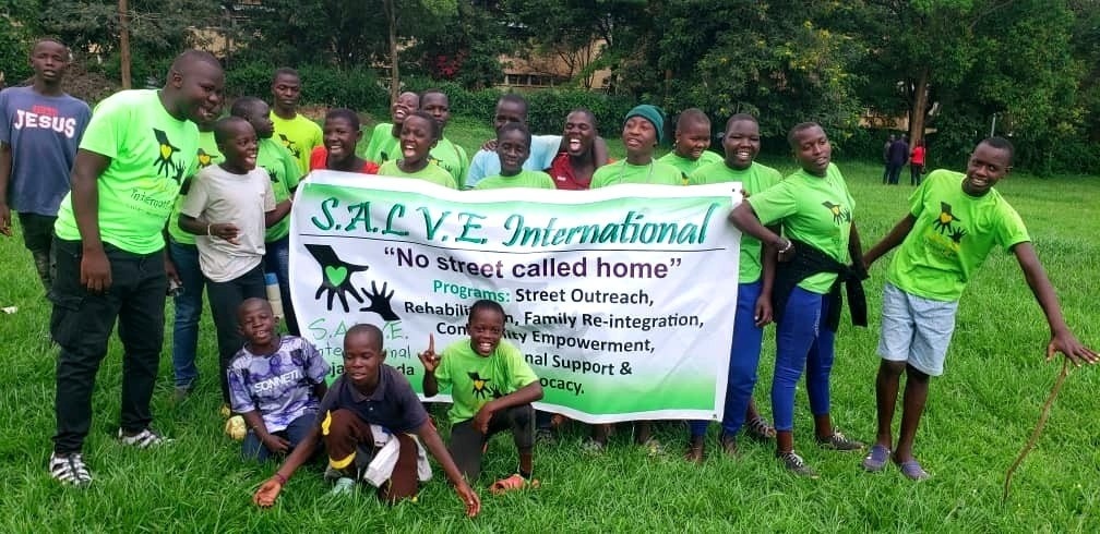 group standing with SALVE banner