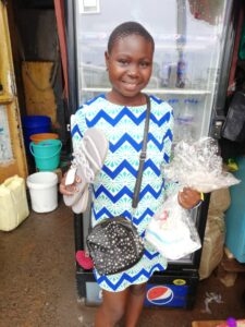Girl smiling holding birthday gift