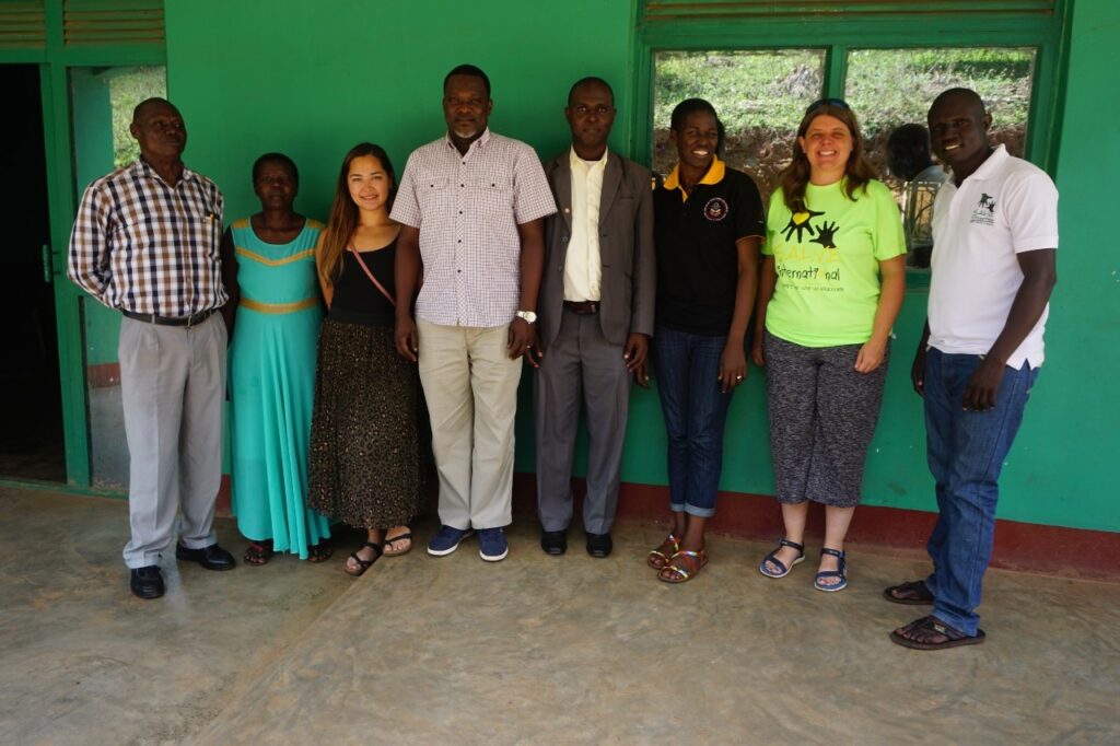 Members of the Ugandan Board standing together smiling