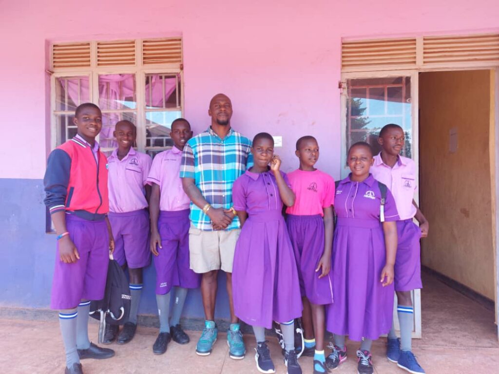 A group of school children standing and posing for the camera