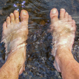 close up of feet in water