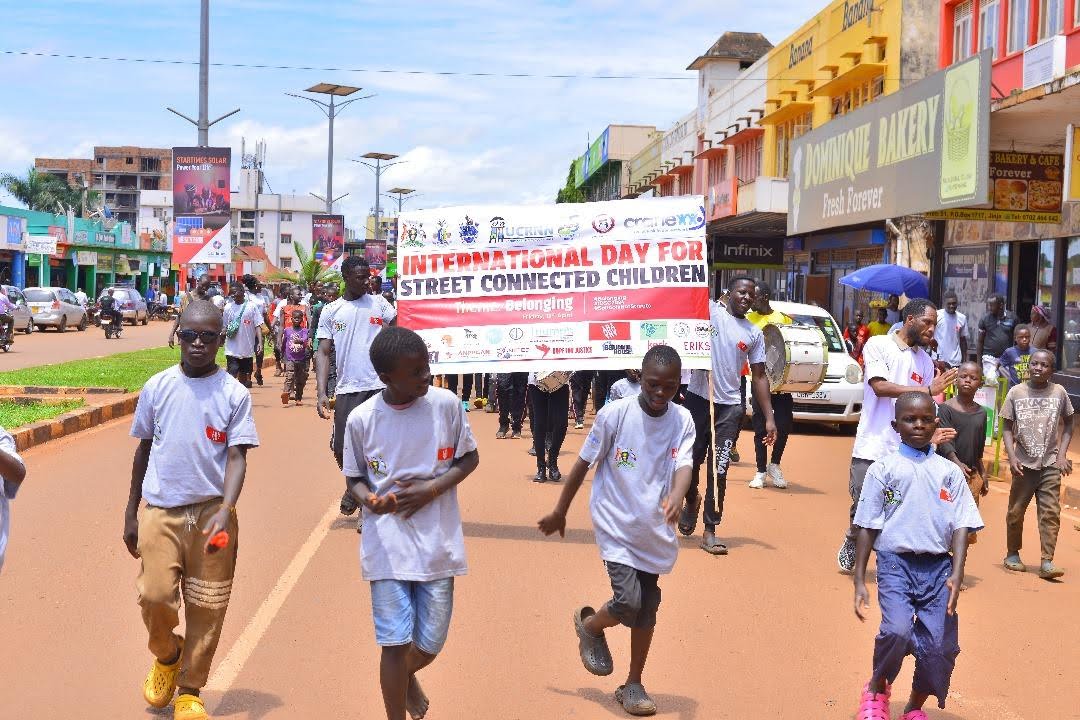 Children marching in a procession for the International Day for Street Children 2024