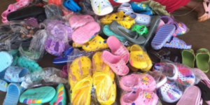 A pile of colourful plastic shoes